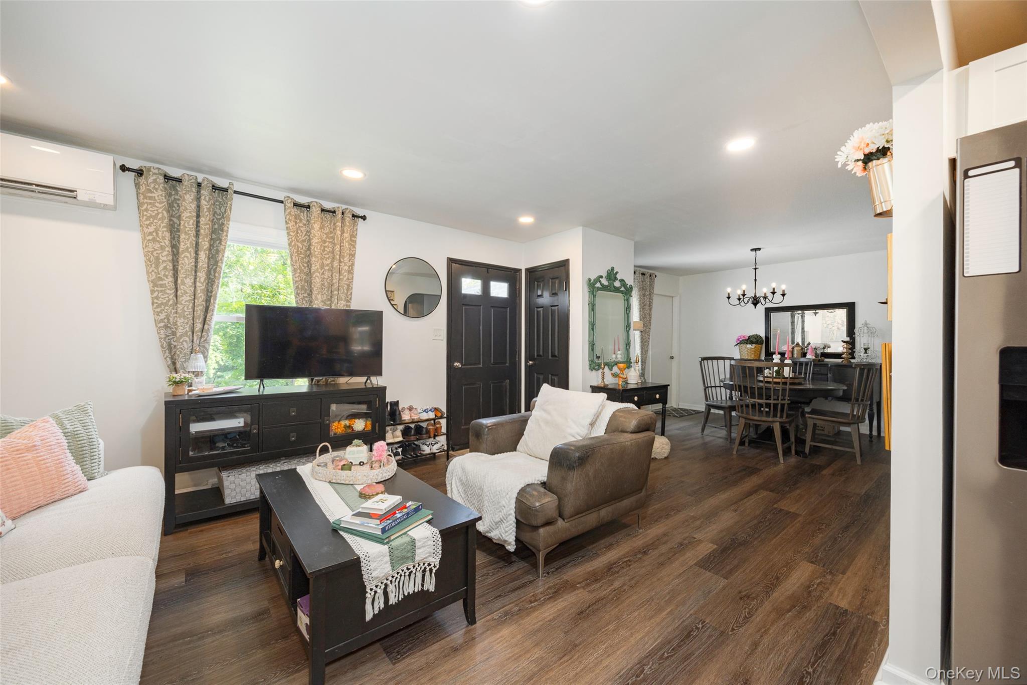 148 Bower Road Poughkeepsie, NY 12603 - Photo 8 of 19 a living room with furniture and a flat screen tv