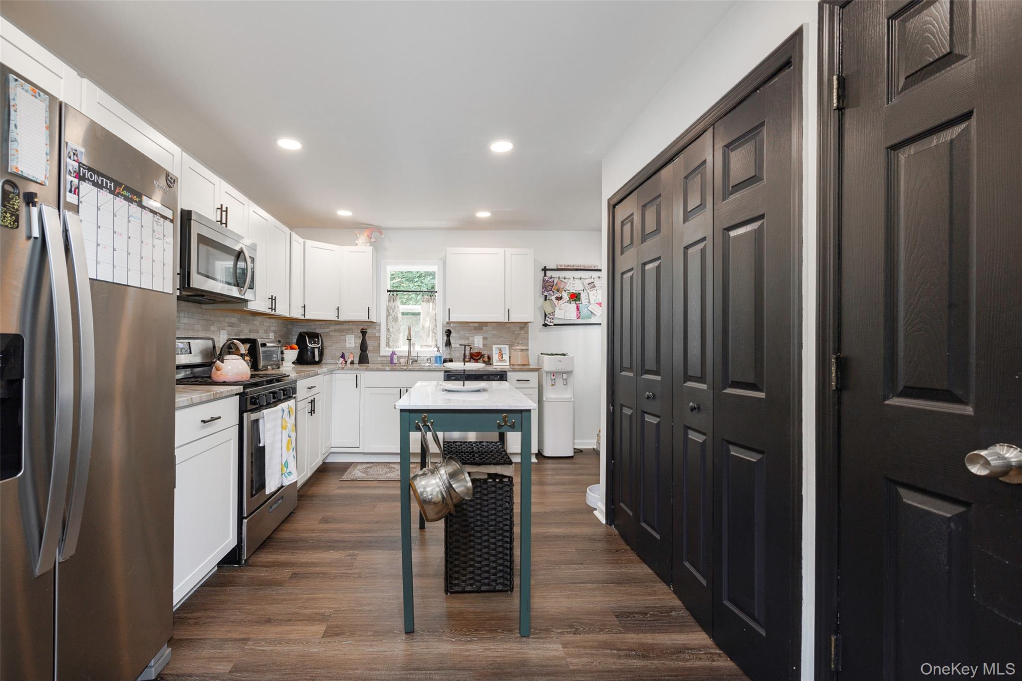 148 Bower Road Poughkeepsie, NY 12603 - Photo 9 of 19 a kitchen with stainless steel appliances granite countertop a refrigerator a stove top oven a sink and dishwasher