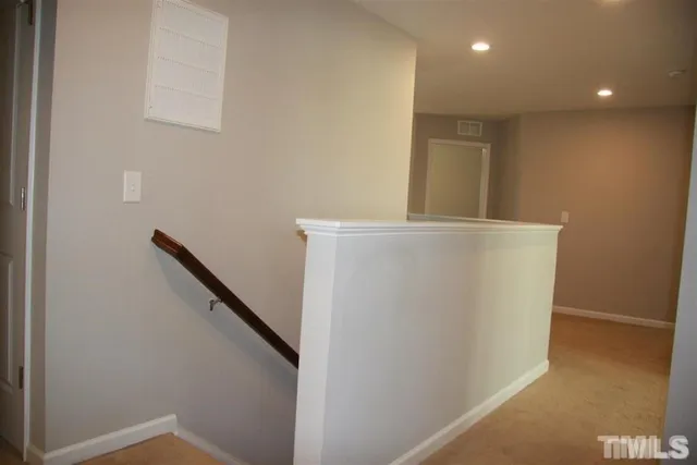 a view of an empty room and closet