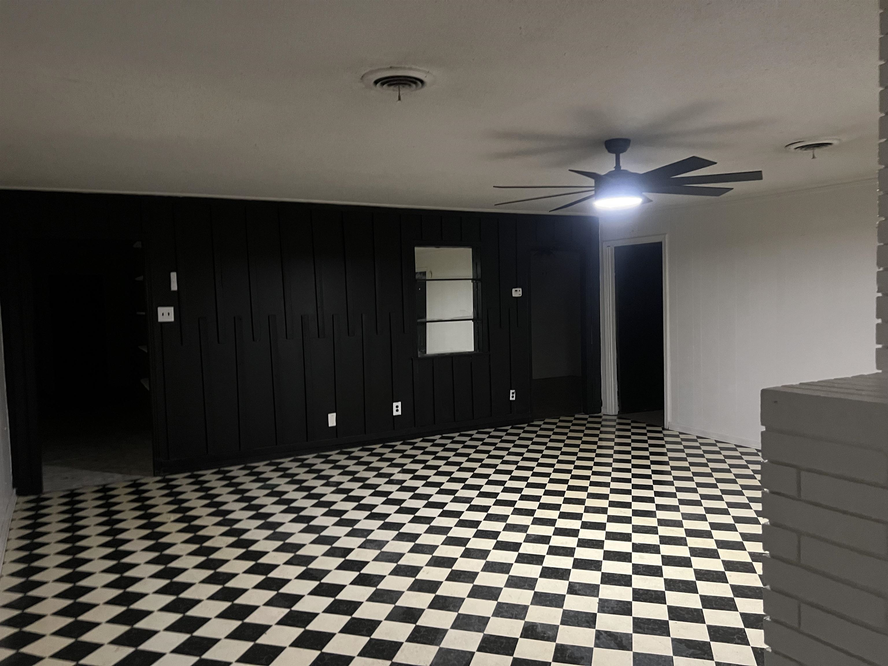 3548 Yokley Road Memphis, TN 38109 - Photo 11 of 16 Empty room with wooden walls