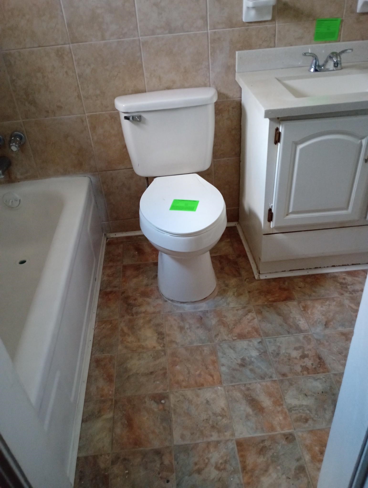 3548 Yokley Road Memphis, TN 38109 - Photo 13 of 16 Bathroom featuring a bathing tub, vanity, toilet, and tile walls