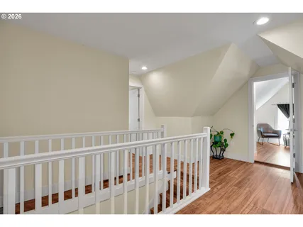 a view of hallway with wooden floor