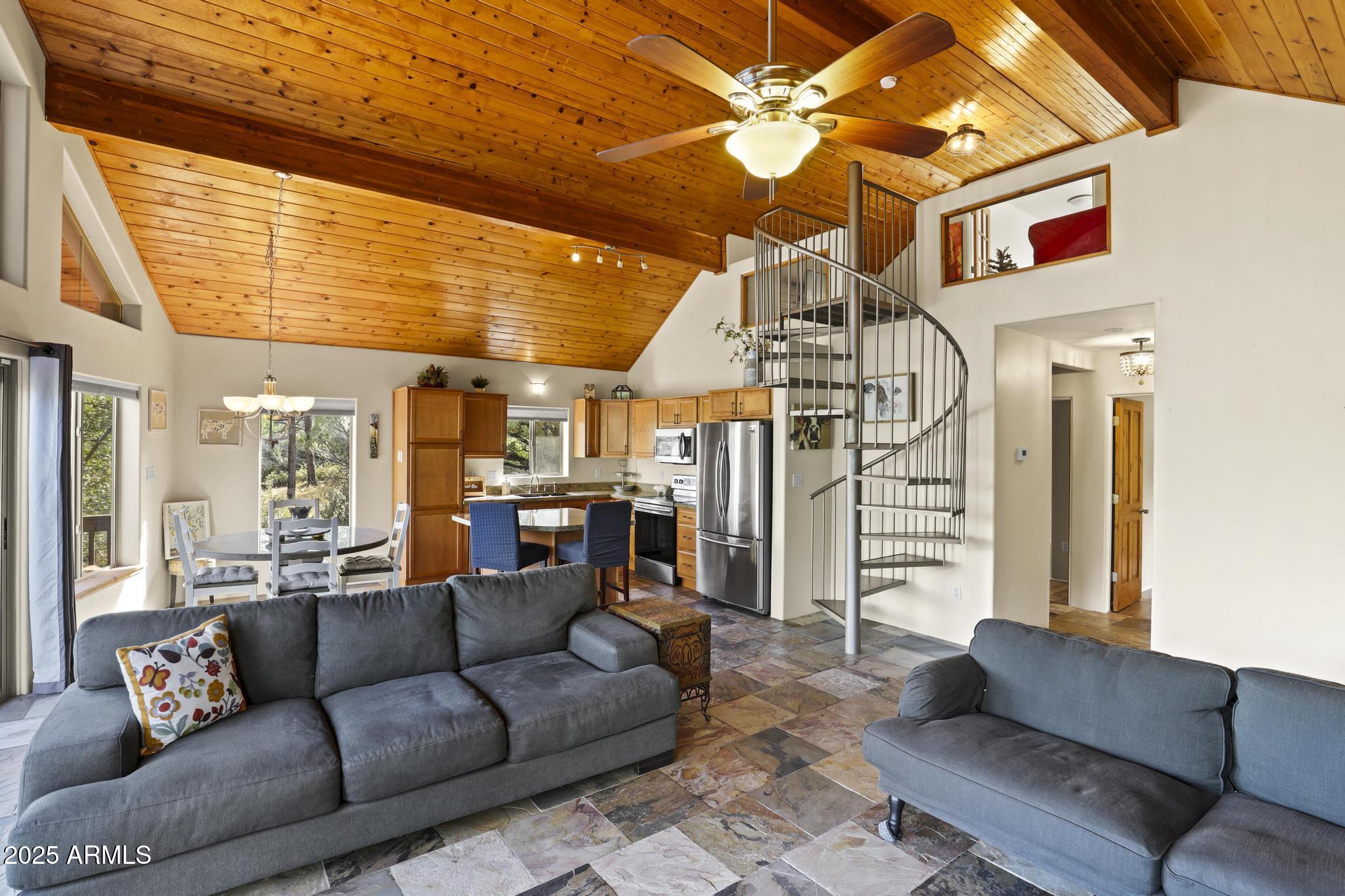 4977 North N Trails Pine, AZ 85544 - Photo 12 of 28 a living room with furniture and a chandelier
