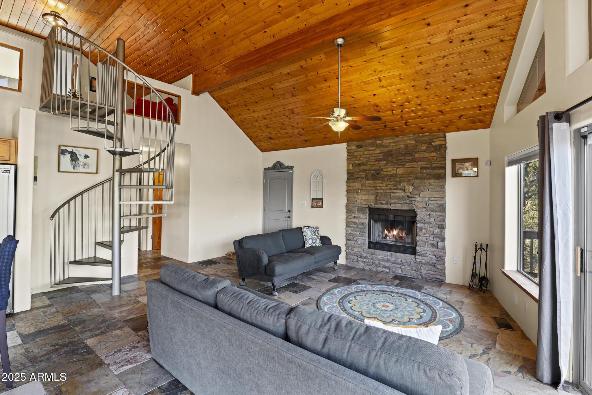 4977 North N Trails Pine, AZ 85544 - Photo 18 of 28 a view of a couches and a fireplace with the wooden floor