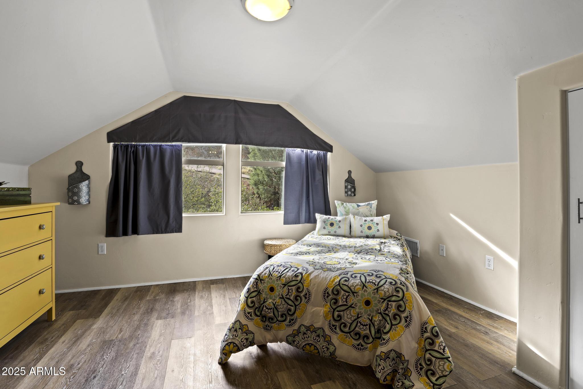 4977 North N Trails Pine, AZ 85544 - Photo 19 of 28 a bedroom with a bed and a window