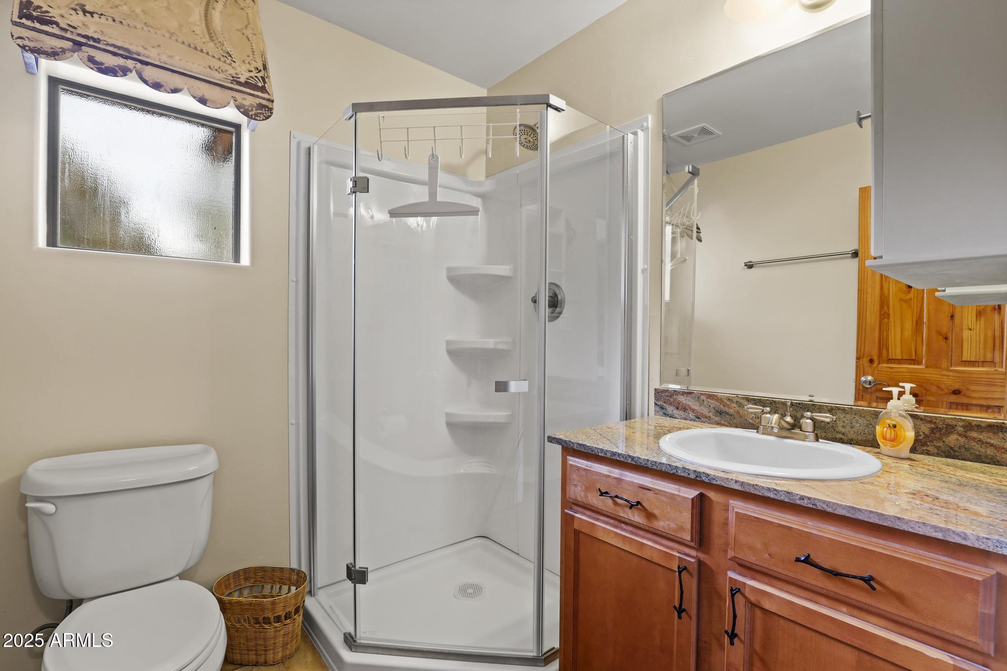 4977 North N Trails Pine, AZ 85544 - Photo 21 of 28 a bathroom with a granite countertop sink toilet and shower