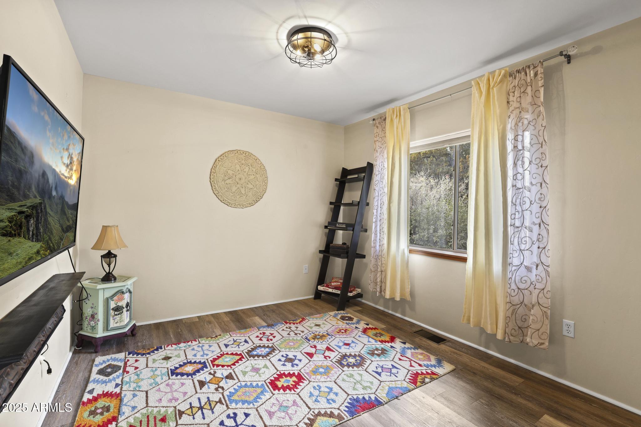4977 North N Trails Pine, AZ 85544 - Photo 22 of 28 a bedroom with a bed and a window