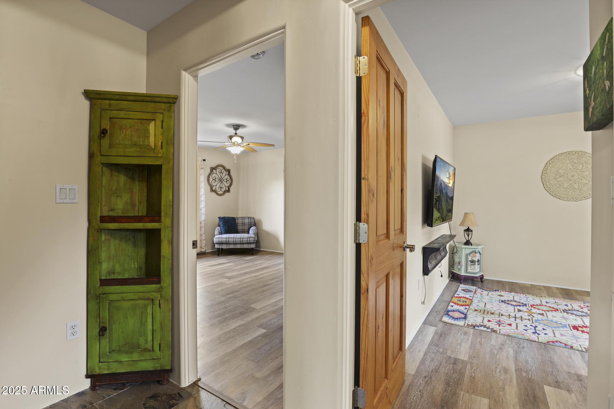 4977 North N Trails Pine, AZ 85544 - Photo 26 of 28 a view of a hallway with wooden floor and a living room