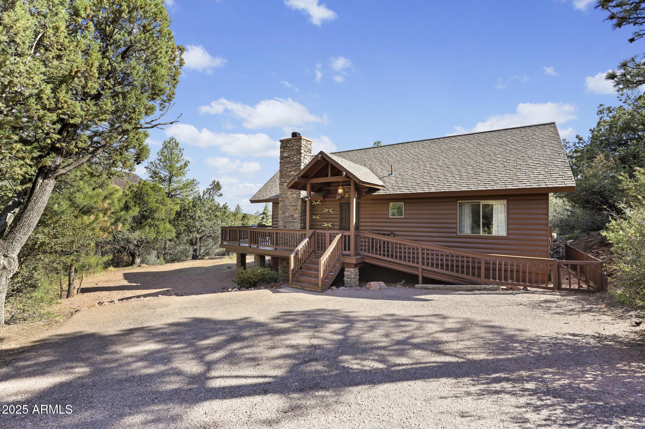 4977 North N Trails Pine, AZ 85544 - Photo 3 of 28 a front view of a house with a yard