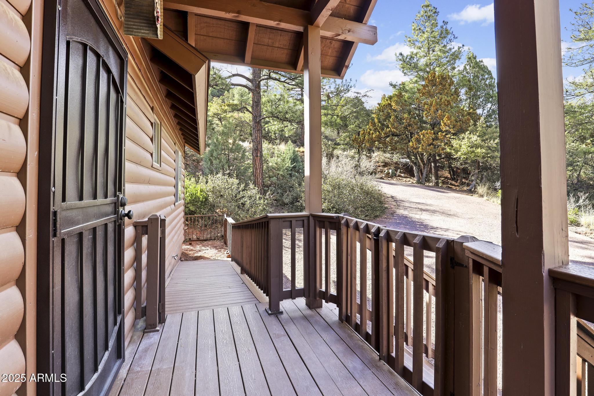 4977 North N Trails Pine, AZ 85544 - Photo 5 of 28 a balcony view with a large window and wooden floor