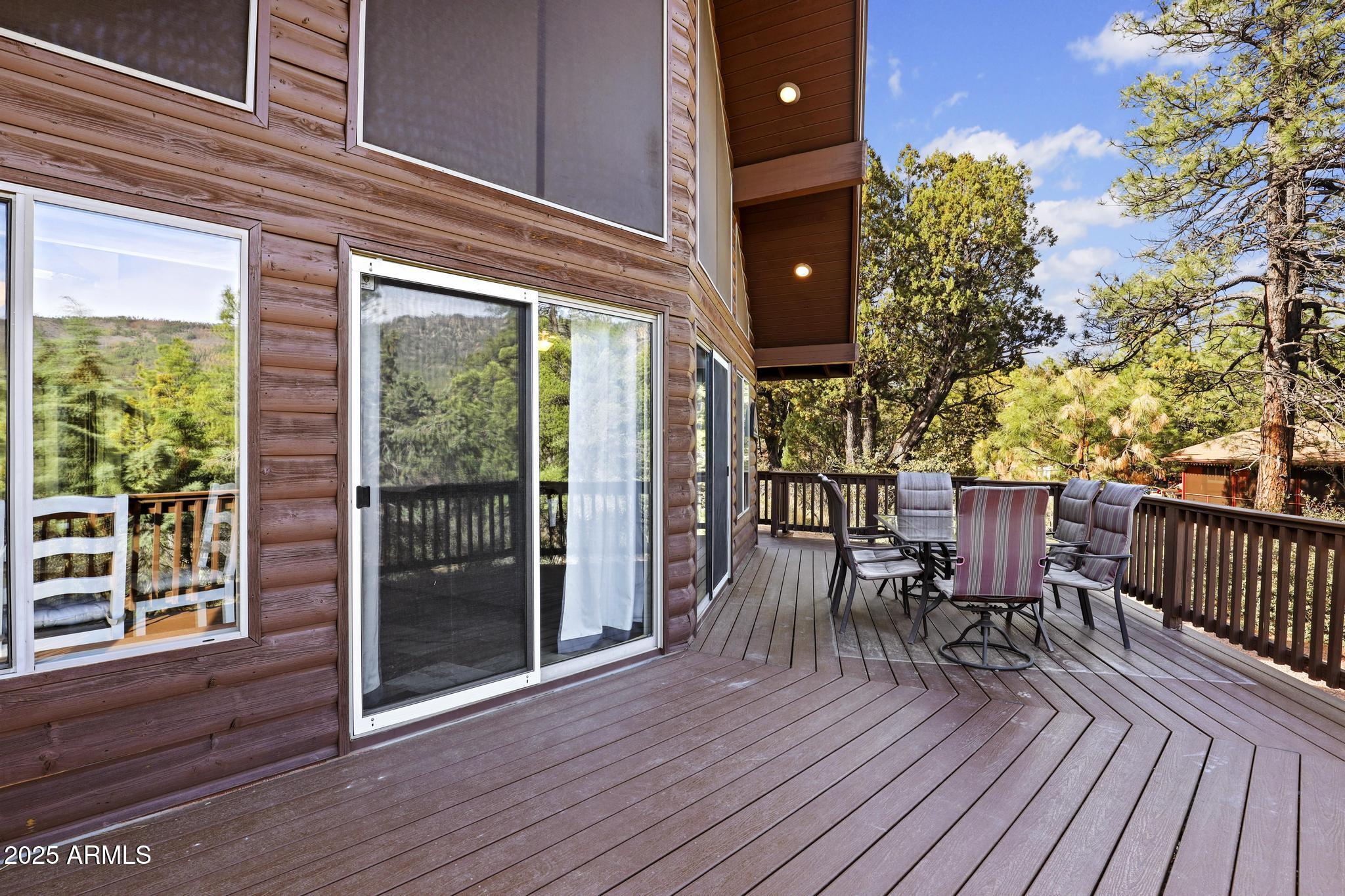4977 North N Trails Pine, AZ 85544 - Photo 7 of 28 a view of a patio with table and chairs and wooden floor