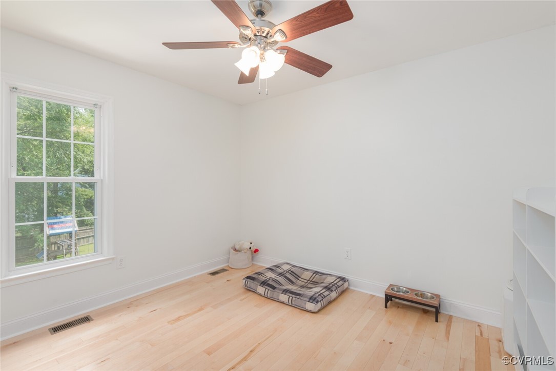 7313 Key Deer Circle Midlothian, VA 23112 - Photo 17 of 45 a view of a room with windows and ceiling fan