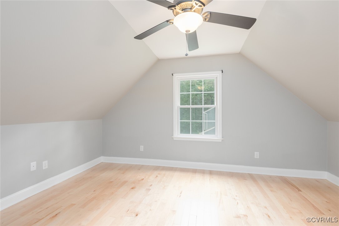 7313 Key Deer Circle Midlothian, VA 23112 - Photo 24 of 45 an empty room with a chandelier fan and windows