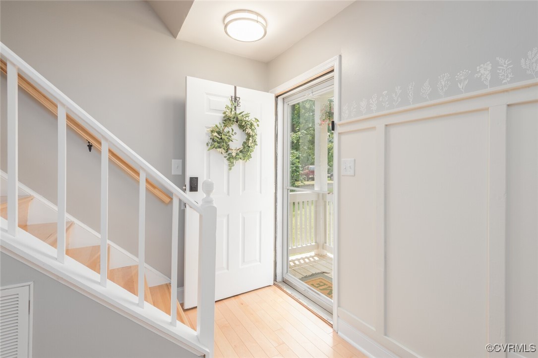 7313 Key Deer Circle Midlothian, VA 23112 - Photo 3 of 45 a view of an entryway with wooden floor and windows