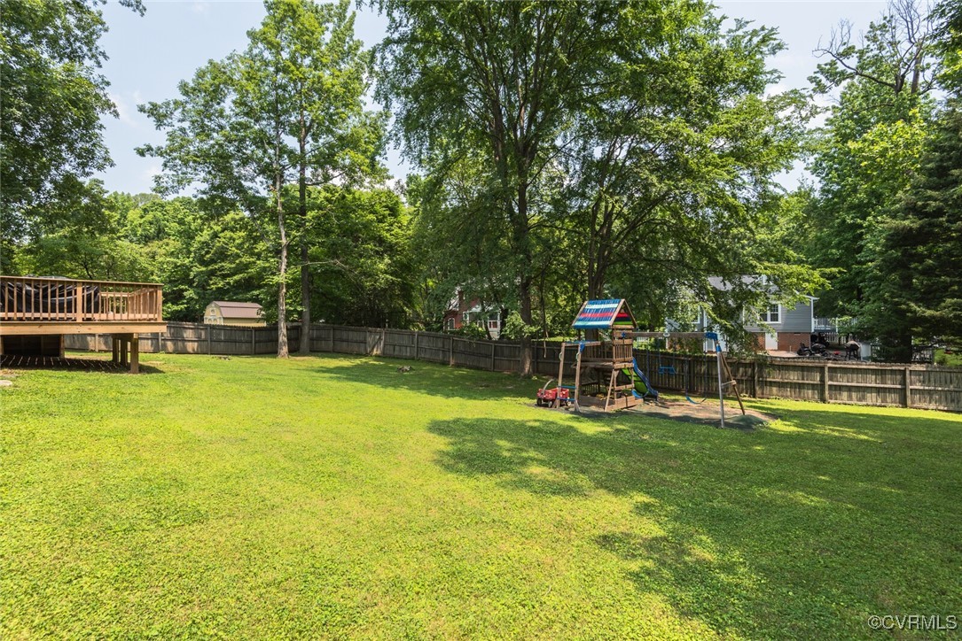 7313 Key Deer Circle Midlothian, VA 23112 - Photo 34 of 45 a view of a swimming pool with a bench in a park