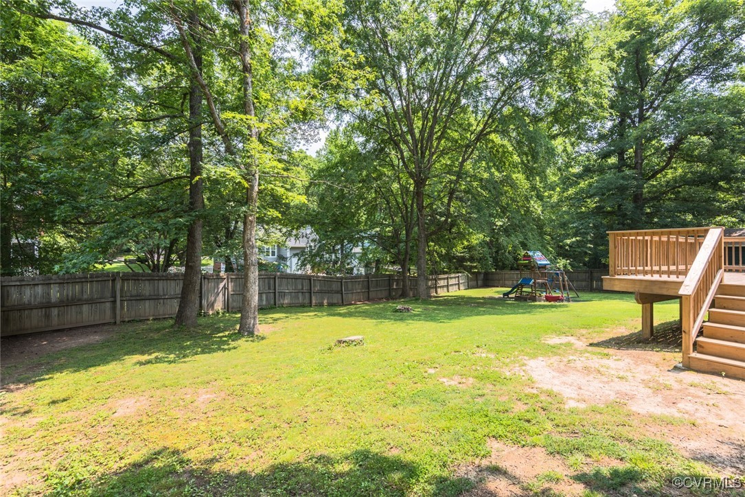 7313 Key Deer Circle Midlothian, VA 23112 - Photo 35 of 45 a view of a swimming pool with a patio and a yard