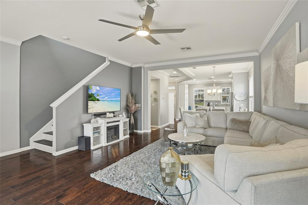 13013 Overstreet Road Windermere, FL 34786 - Photo 13 of 47 a living room with furniture and a flat screen tv