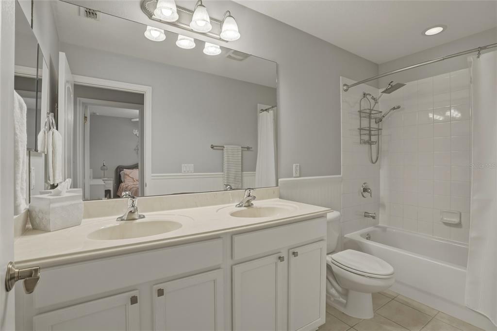 13013 Overstreet Road Windermere, FL 34786 - Photo 17 of 47 a bathroom with a sink a toilet and shower