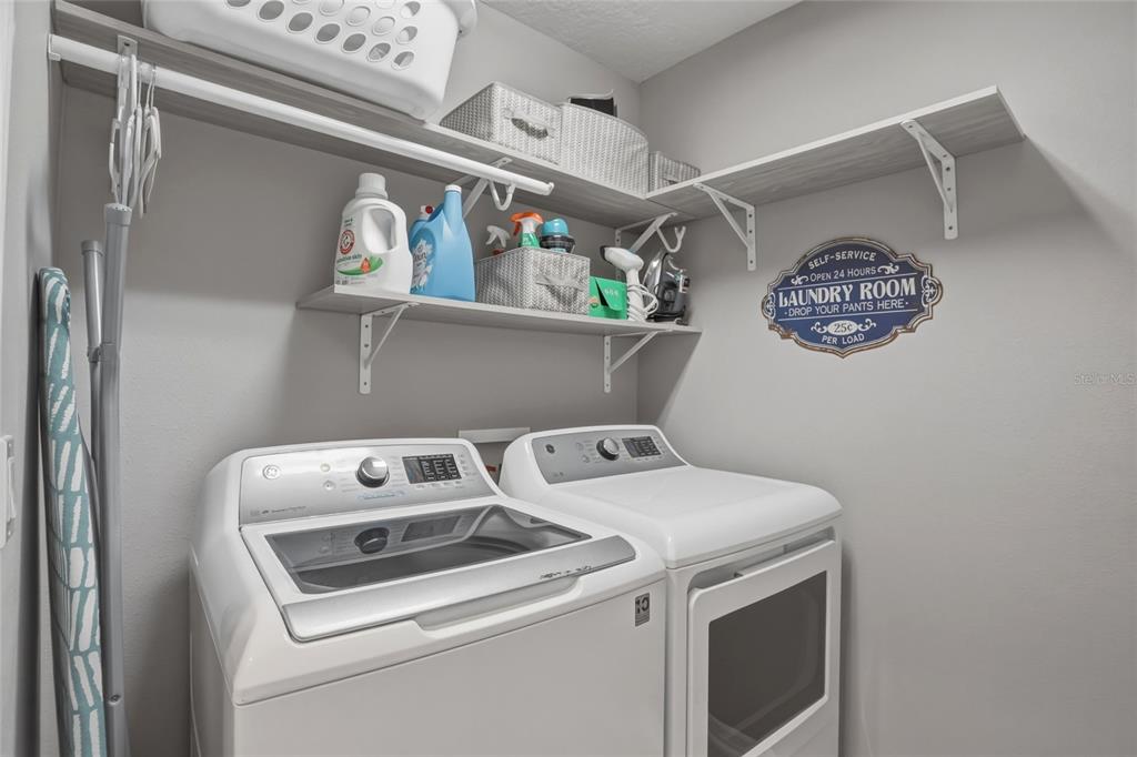 13013 Overstreet Road Windermere, FL 34786 - Photo 20 of 47 a utility room with dryer and washer