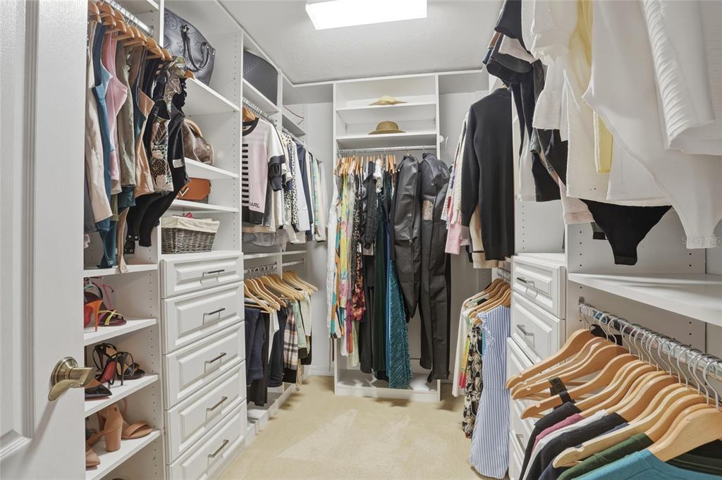 13013 Overstreet Road Windermere, FL 34786 - Photo 25 of 47 a view of walk in closet with clothes and shoes