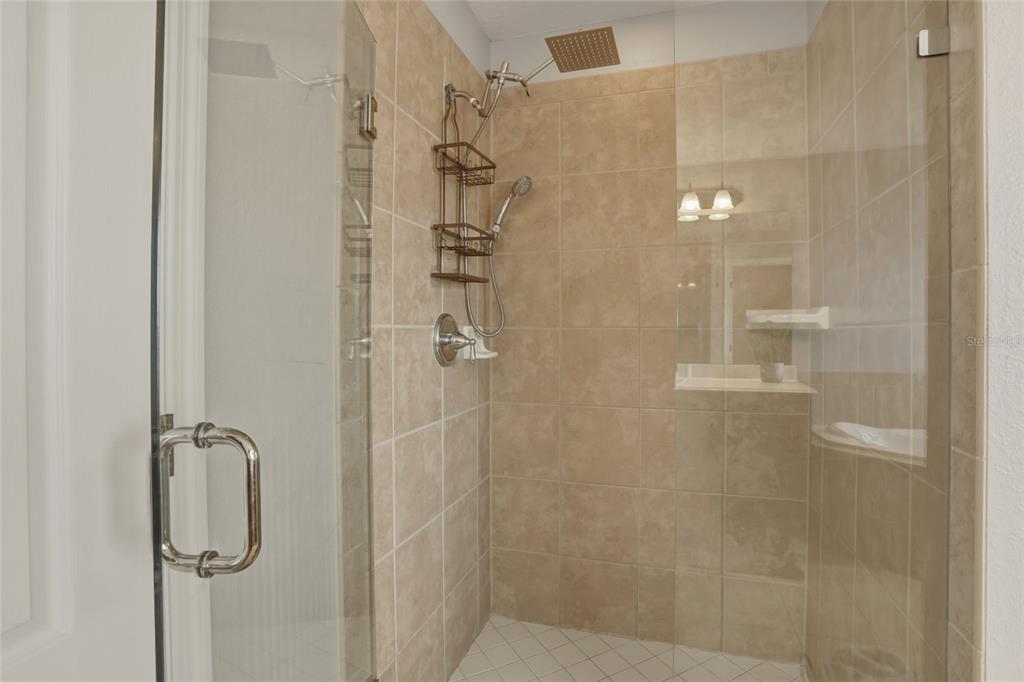 13013 Overstreet Road Windermere, FL 34786 - Photo 29 of 47 a bathroom with a shower