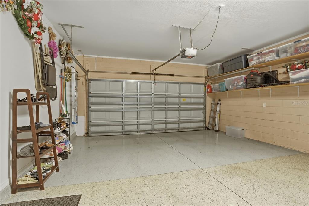 13013 Overstreet Road Windermere, FL 34786 - Photo 31 of 47 a view of a garage with stairs