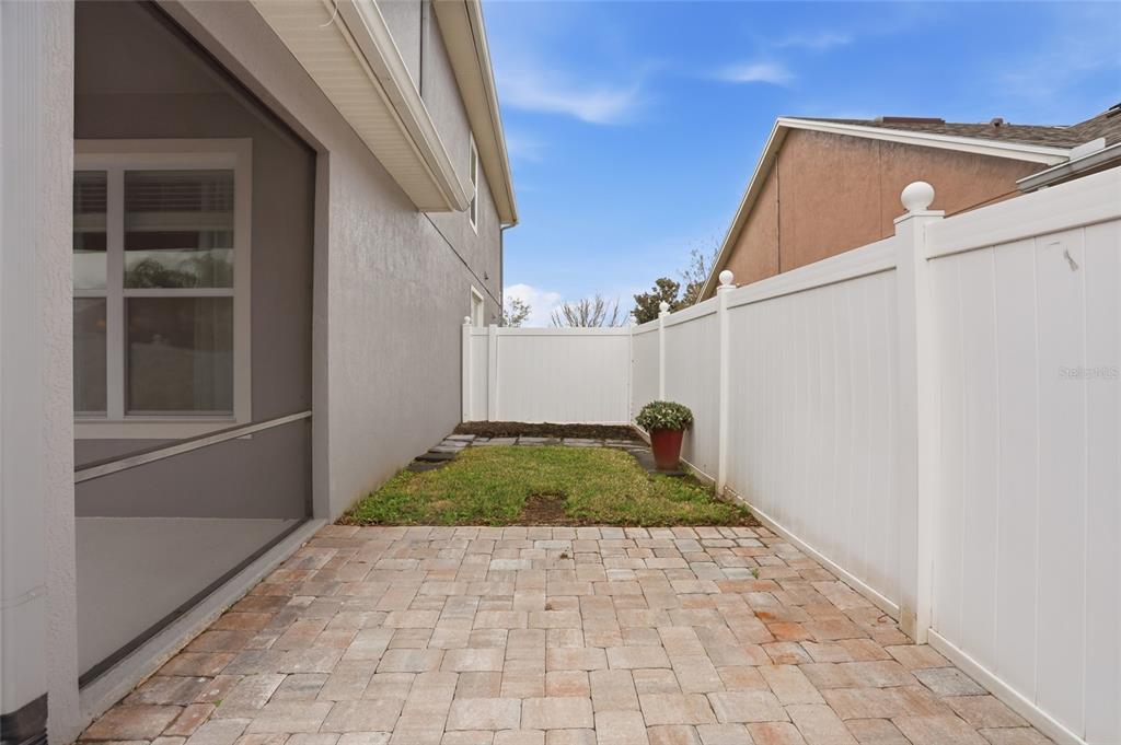 13013 Overstreet Road Windermere, FL 34786 - Photo 39 of 47 a view of backyard with garage and window
