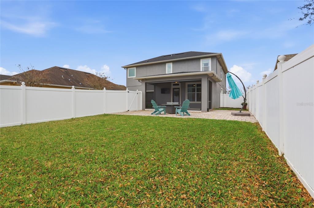 13013 Overstreet Road Windermere, FL 34786 - Photo 40 of 47 a front view of a house with garden