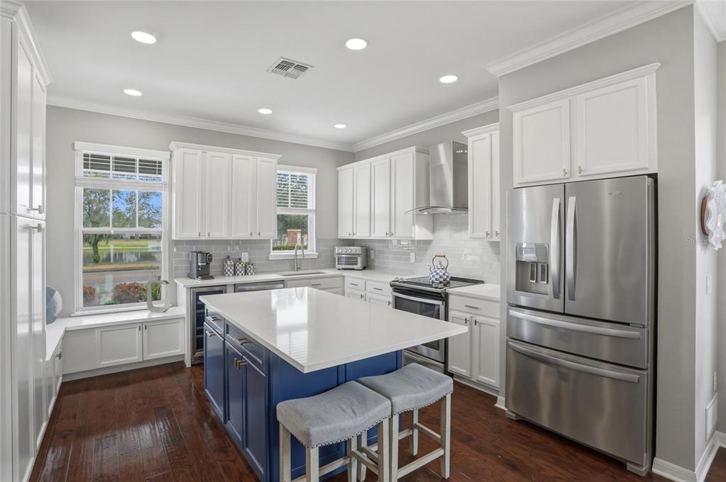 13013 Overstreet Road Windermere, FL 34786 - Photo 4 of 47 a kitchen with stainless steel appliances granite countertop a refrigerator stove and sink