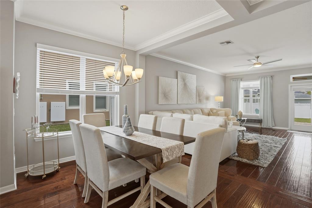 13013 Overstreet Road Windermere, FL 34786 - Photo 8 of 47 a view of a dining room with furniture window and wooden floor