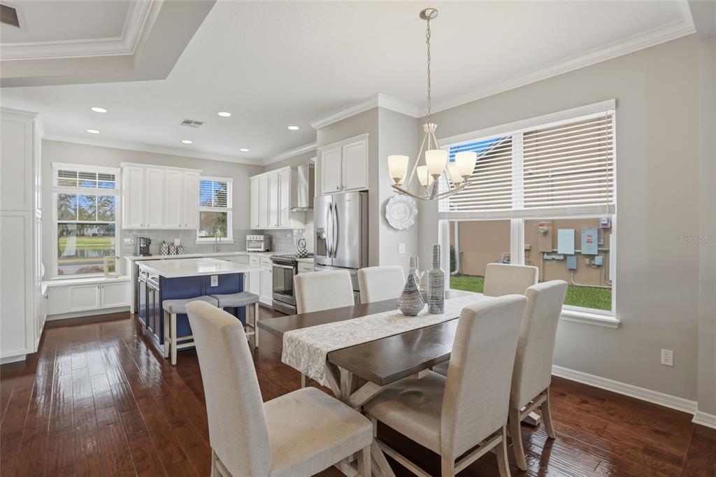 13013 Overstreet Road Windermere, FL 34786 - Photo 9 of 47 a view of a dining room with furniture window and wooden floor