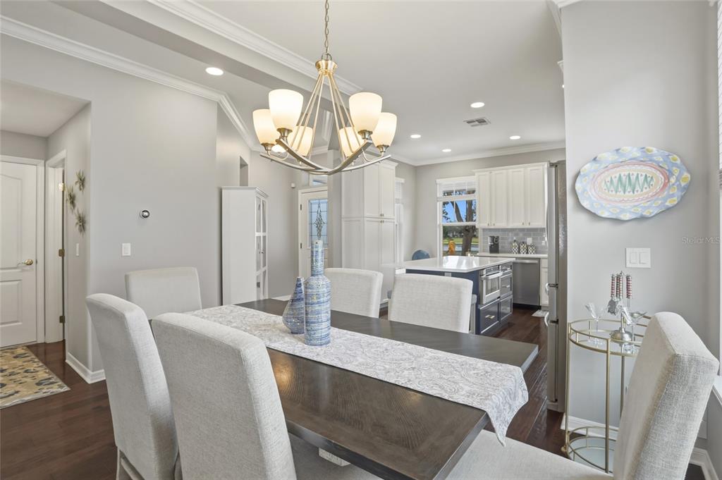 13013 Overstreet Road Windermere, FL 34786 - Photo 10 of 47 a large kitchen with a table and chairs