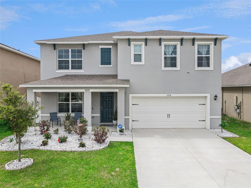3914 Resting Robin Avenue Bartow, FL 33830 - Photo 1 of 45 a front view of house with yard and porch