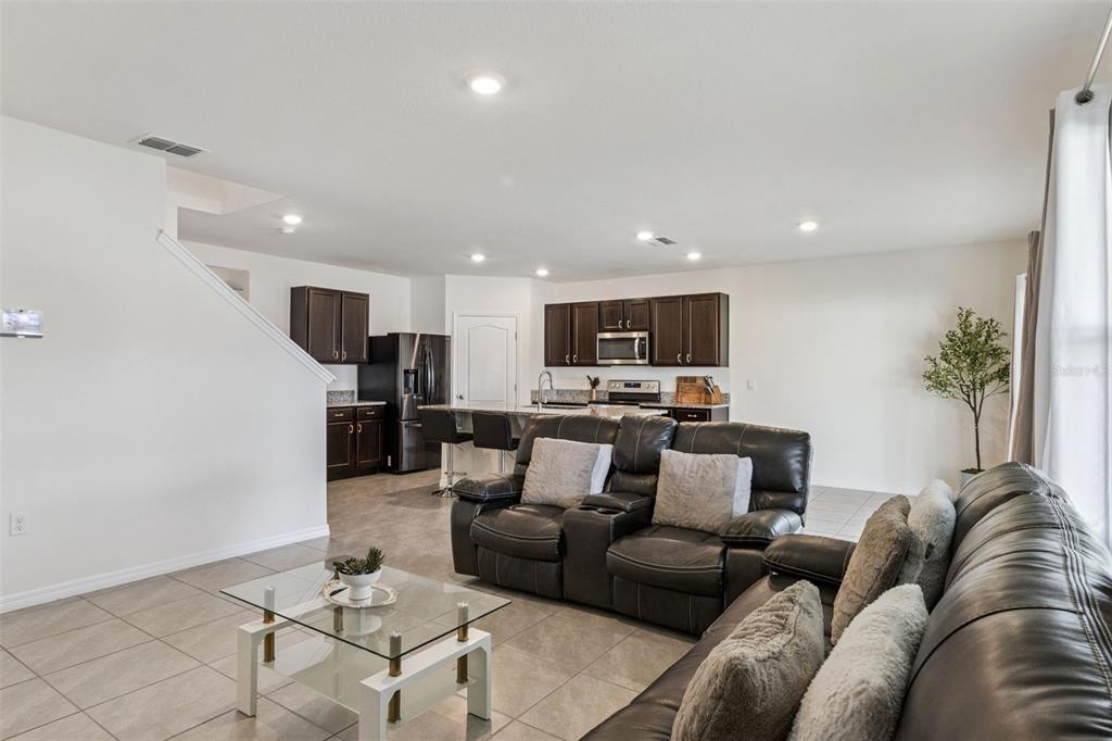 3914 Resting Robin Avenue Bartow, FL 33830 - Photo 14 of 45 a living room with furniture kitchen view and a potted plant