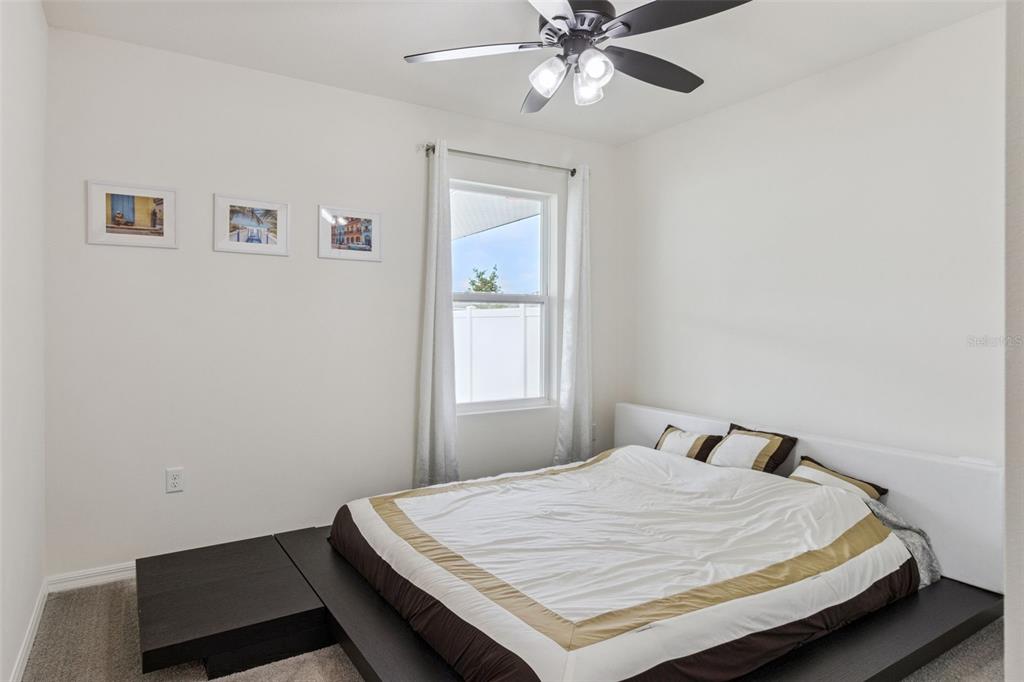 3914 Resting Robin Avenue Bartow, FL 33830 - Photo 16 of 45 a bedroom with a bed and window