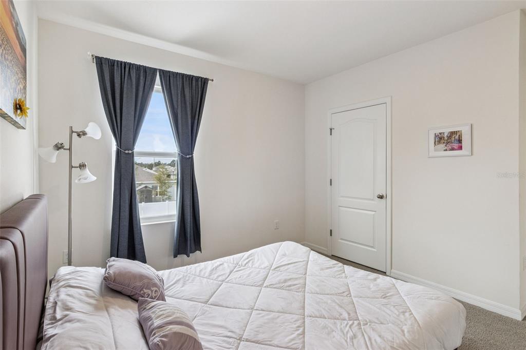 3914 Resting Robin Avenue Bartow, FL 33830 - Photo 24 of 45 a bedroom with a bed and a window