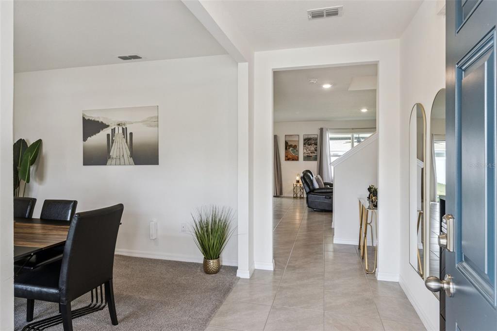 3914 Resting Robin Avenue Bartow, FL 33830 - Photo 3 of 45 a living room with furniture and a wooden floor