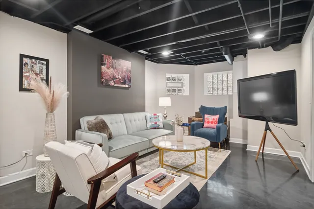 a living room with furniture and a flat screen tv