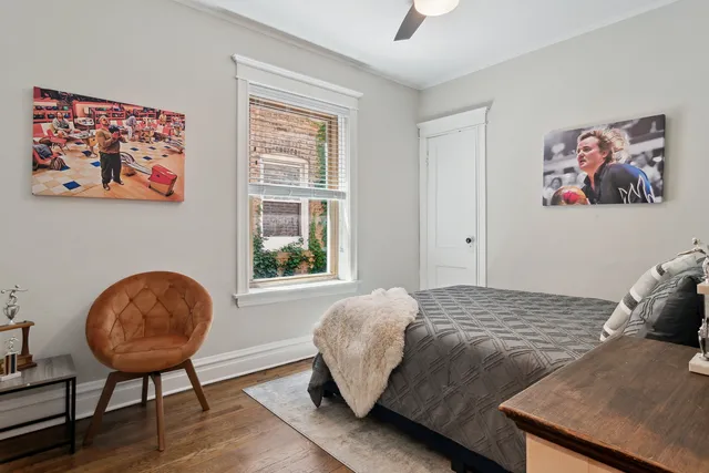 a bedroom with a bed and a chair