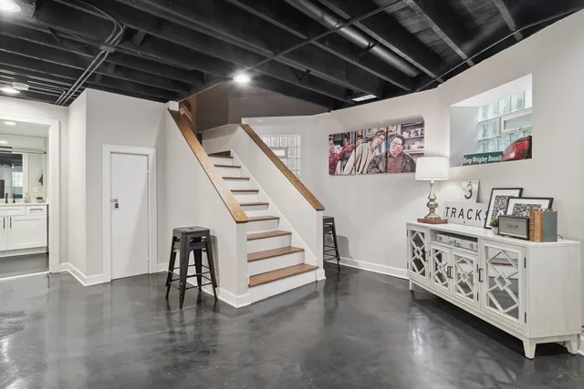 a view of livingroom with furniture and stairs with wooden floor