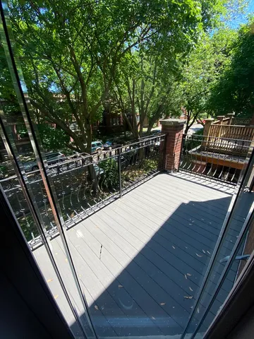 a view of a wooden floor and outdoor space