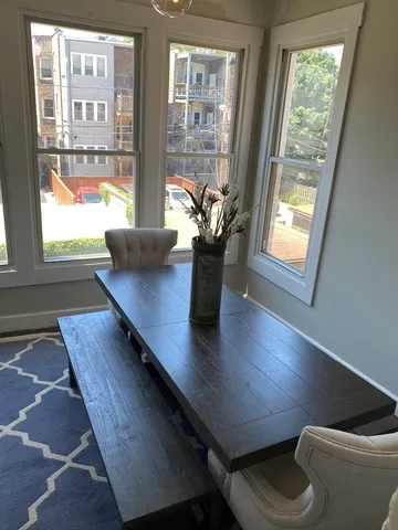 a view of a living room with furniture and window
