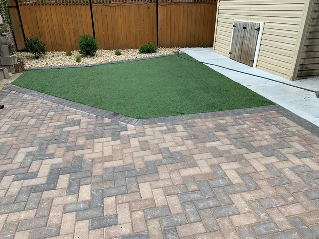 a view of backyard with tub and utility