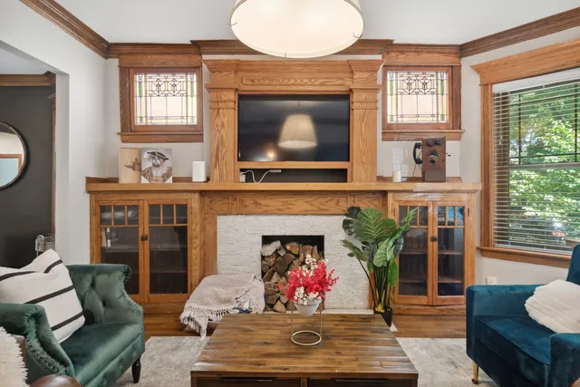 a living room with furniture and a fireplace
