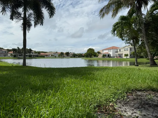 a view of a lake with houses in background