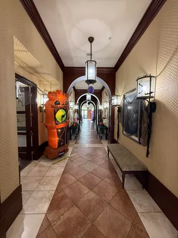 an entryway of a house and livingroom with furniture