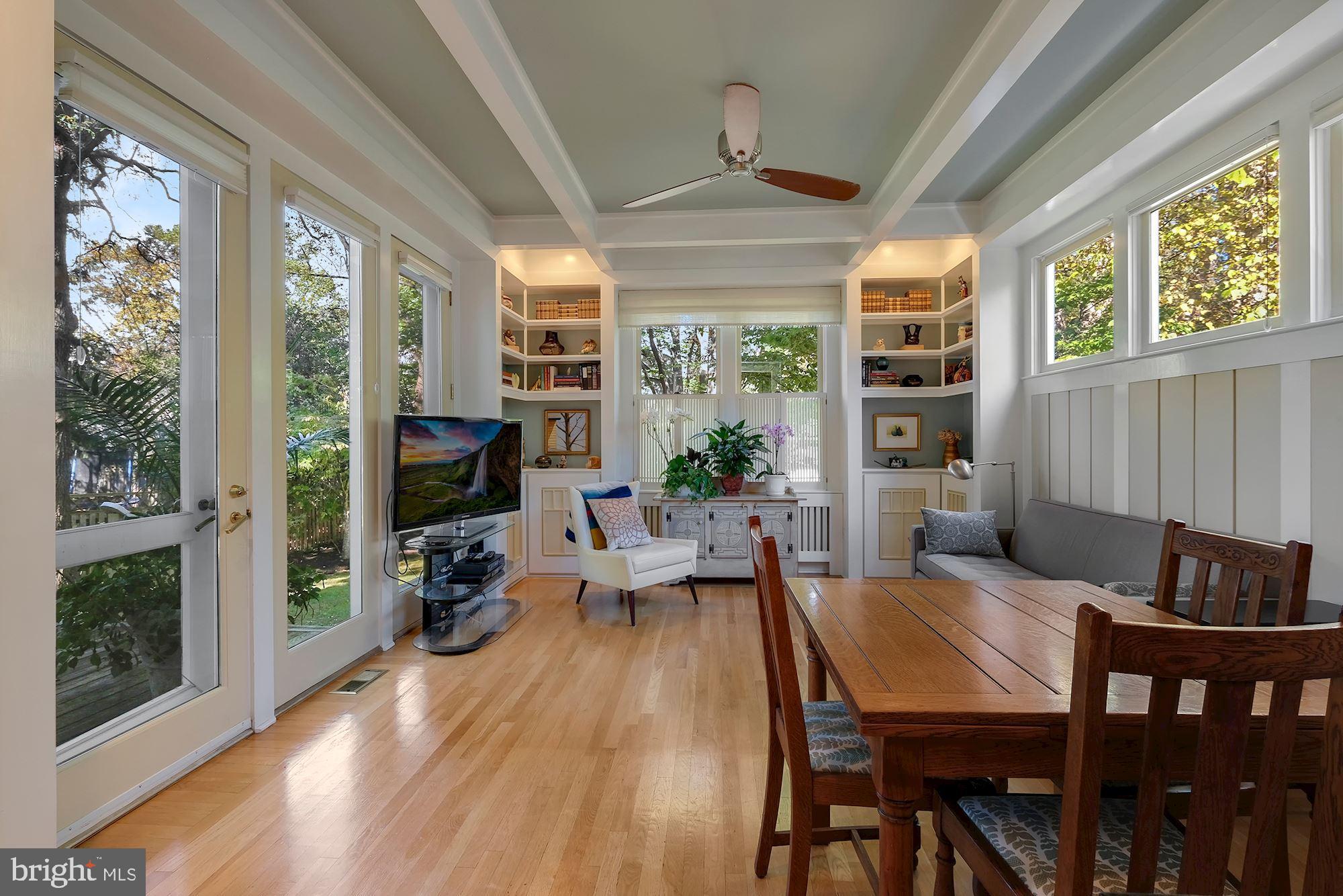 3523 Bradley Lane Chevy Chase, MD 20815 - Photo 11 of 28 Family room with built-ins and door to deck