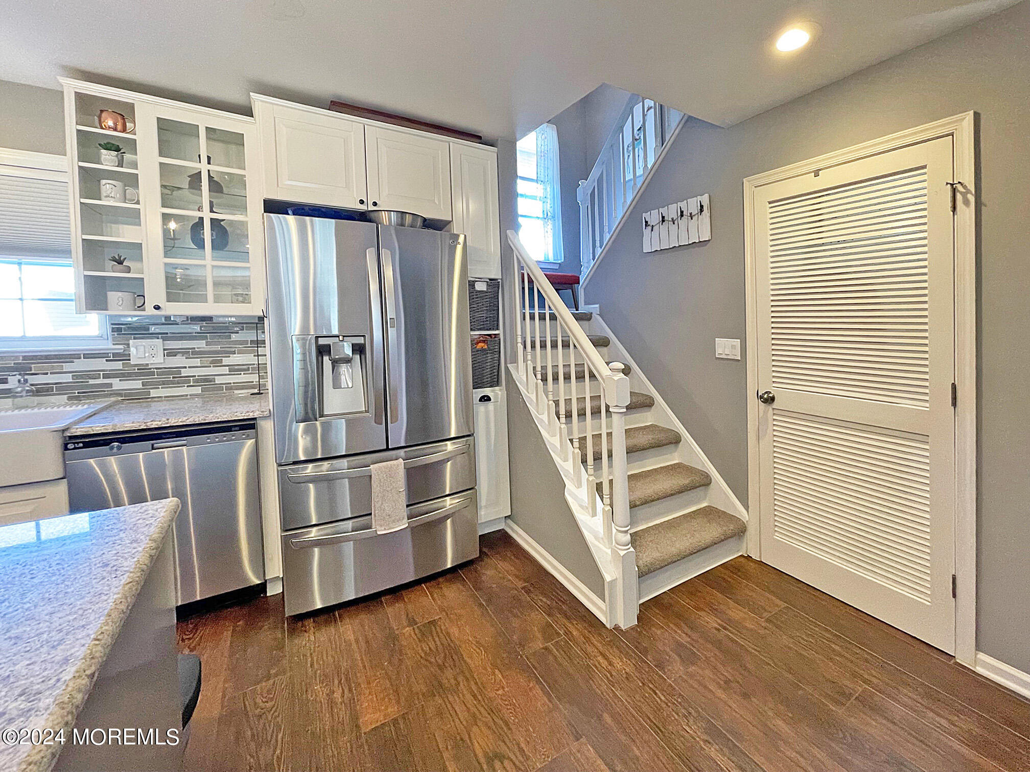 139 3rd Street, Unit 2 Keyport, NJ 07735 - Photo 12 of 36 a view of kitchen with stainless steel appliances wooden floor and window
