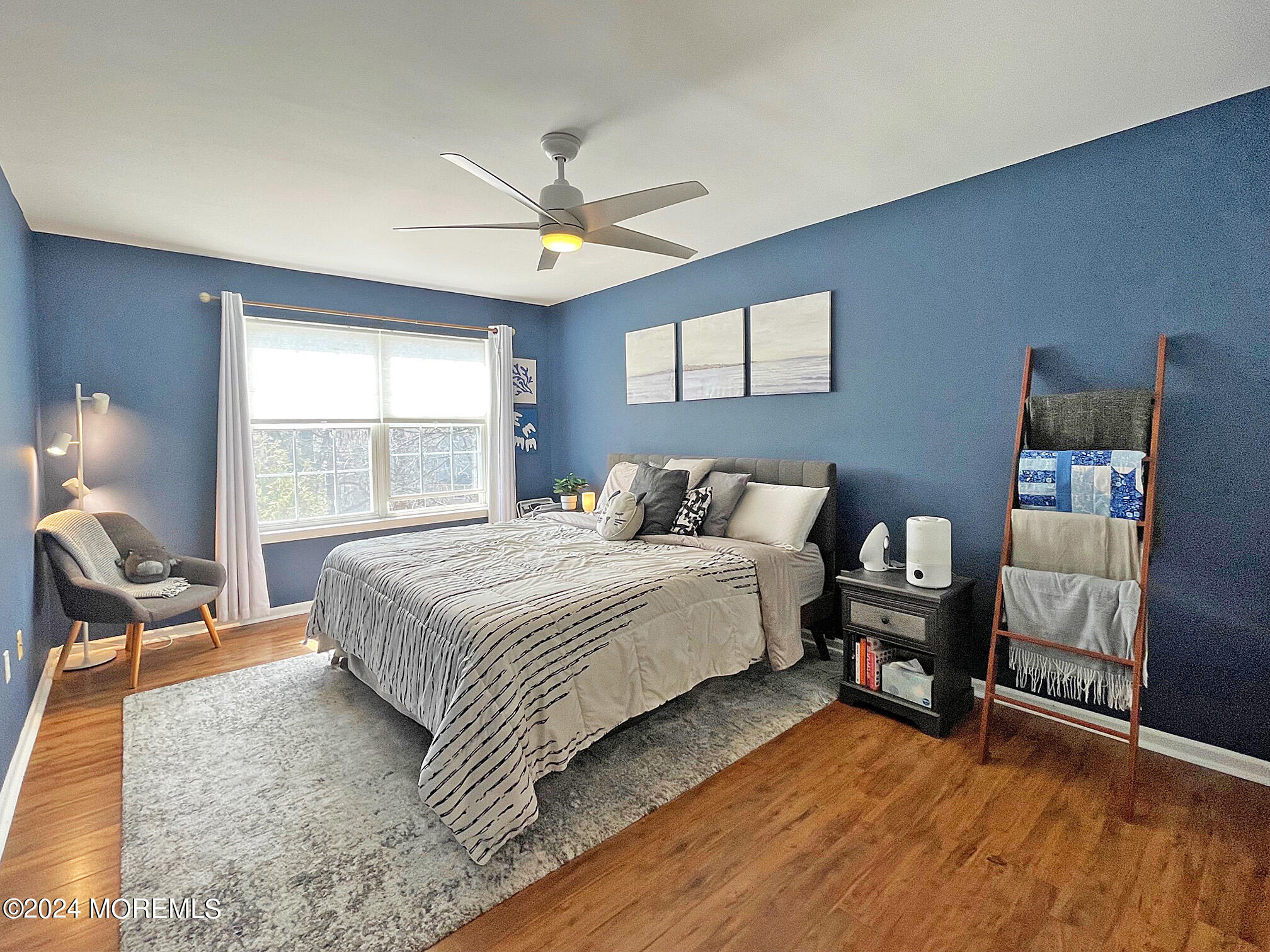 139 3rd Street, Unit 2 Keyport, NJ 07735 - Photo 16 of 36 a bedroom with a bed and wooden floor