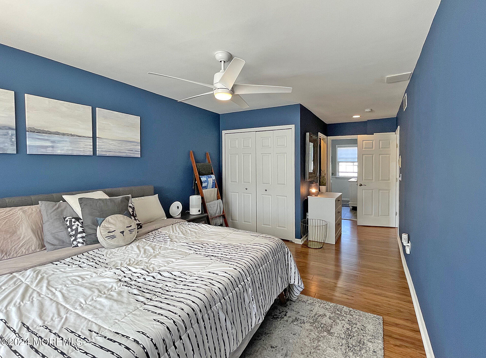 139 3rd Street, Unit 2 Keyport, NJ 07735 - Photo 17 of 36 a bedroom with a large bed and a chandelier
